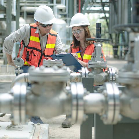 Two workers in personal protective equipment